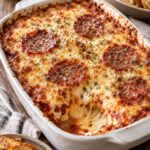 Extra Cheesy Oven-Baked Pizza Dip with Triple-Cheese Foundation and Savory Salami Armor