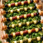 Festive Foosball Salad Stadium with Crisp Lye Bread Player Skewers, Kabanossi, and Cornichons