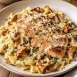 Juicy Pan-Seared Chicken Breast over Supple Ribbon Noodles in Rich Marsala Wine and Chive Cream Sauce