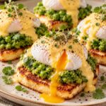 Elite Artisan Eggs Benedict over Golden Halloumi Mattress, Crushed Pea Guacamole and Warm Velvet Hollandaise Armor