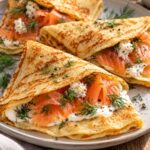 Elite Artisan Nordic Crêpes with Soft Swirled Egg Mattress, Smoked Salmon Loin and Pungent Horseradish Armor